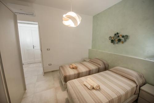 Ένα ή περισσότερα κρεβάτια σε δωμάτιο στο Lecce Santa Chiara Terrace piano rialzato