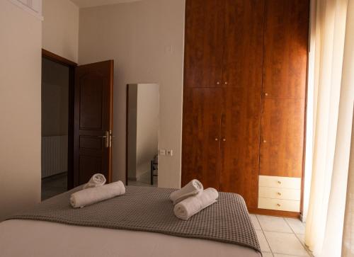 En eller flere senge i et værelse på CITY CENTER VILLA HERSONISOS