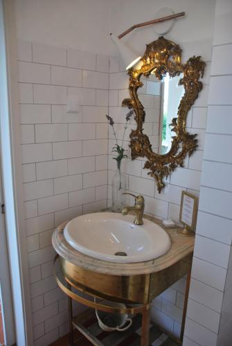 a bathroom with a sink and a mirror at Monte Ramos in Ferreira do Alentejo