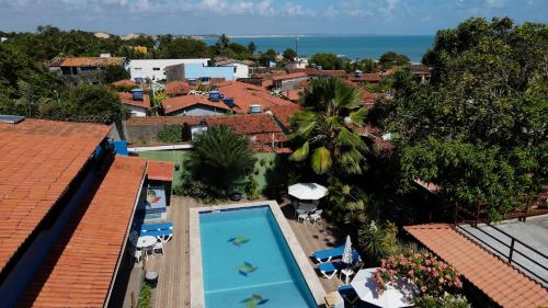 an aerial view of a resort with a swimming pool at Pousada Catavento in Pipa