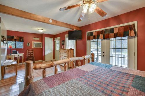 a bedroom with a bed and a ceiling fan at Sweetpeas in Pigeon Forge