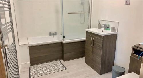 a bathroom with a shower and a sink at Penthouse, 2 Bedroom apartment in Great Yarmouth
