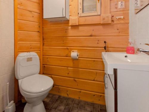 a bathroom with a toilet and a sink at Holiday Home Amero purnu 4 in Kolinkylä