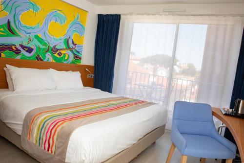 En eller flere senge i et værelse på Best Western Arcachon Le Port