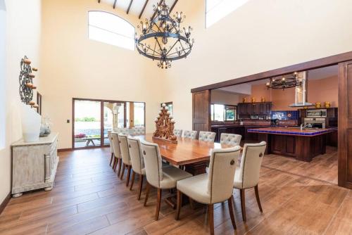 a dining room with a table and chairs at Villa El Retiro Luxury Property in Alajuela City