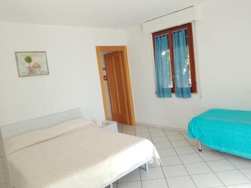 Postel nebo postele na pokoji v ubytování B & B dépendance