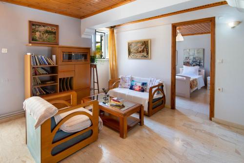 a living room with a couch and a table at Sterna House Paxos in Vlachopoulátika