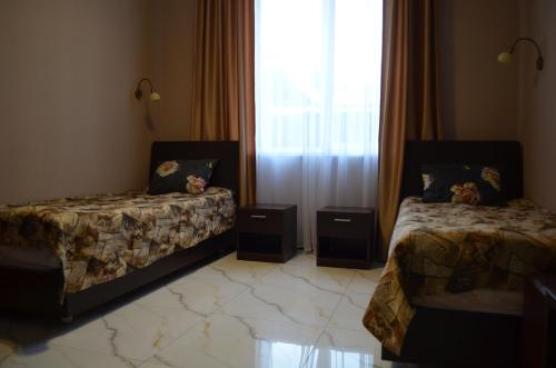 Ένα ή περισσότερα κρεβάτια σε δωμάτιο στο Hotel Albatros