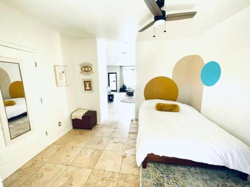 a bedroom with a large bed and a hallway at Pet Friendly! Private retreat in Nob Hill in Albuquerque
