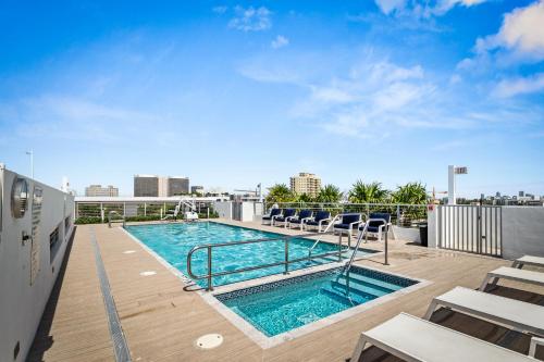 a swimming pool on the roof of a building at Bay Harbor One Vacation in Miami Beach