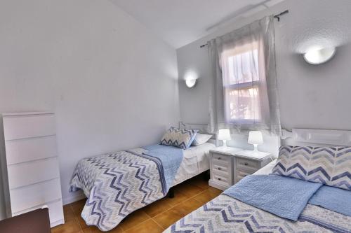 A bed or beds in a room at Bungalow Santa Fe de 2 habitaciones