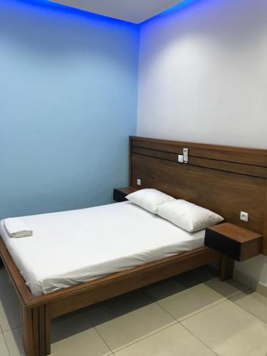 Ένα ή περισσότερα κρεβάτια σε δωμάτιο στο Appartement contemporain et calme à Yaoundé