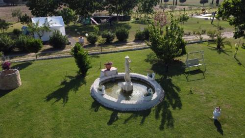 an aerial view of a fountain in a park at Villa Isabella in Marina di Grosseto
