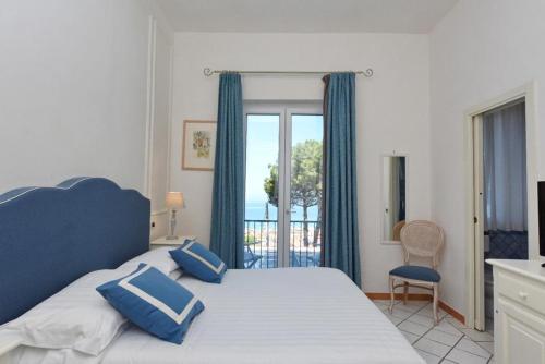 Postel nebo postele na pokoji v ubytování Hotel Garden Riviera