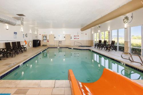 a large swimming pool with an orange object in it at Comfort Inn & Suites Logan Near University in Logan