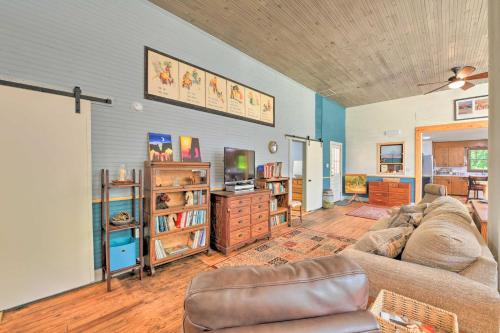 a living room with a couch and a tv at Bright Converted Schoolhouse in Chesterfield! in Chesterfield