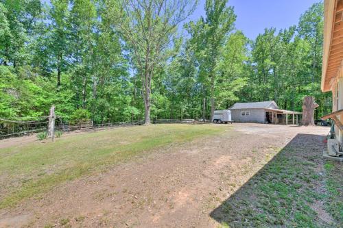 an open yard with a barn and a house at Bright Converted Schoolhouse in Chesterfield! in Chesterfield