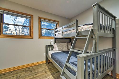 a bedroom with bunk beds and a bunk bed at Lakefront Applegate Retreat with Private Beach! in Applegate