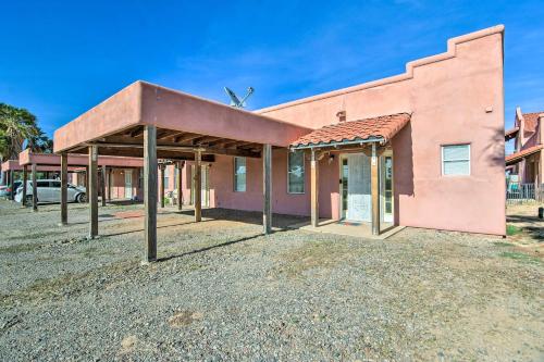 an old pink building with a roof at Rejuvenating Retreat with Ideal Eloy Location! in Eloy