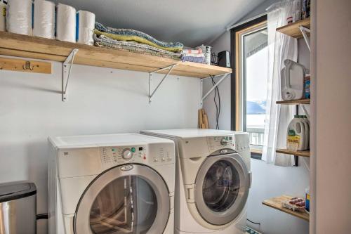 a laundry room with a washer and dryer at Remote Island Escape with Breathtaking Views in Tenakee Springs