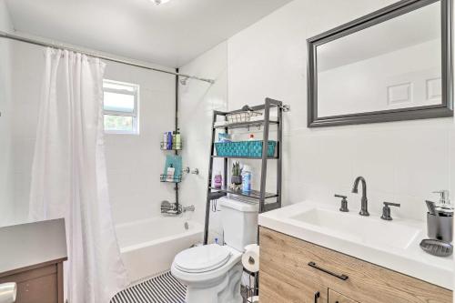a bathroom with a sink and a toilet and a shower at Beautiful Miami Getaway Less Than 6 Mi to Downtown! in Miami