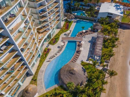 an aerial view of a swimming pool at a resort at Camino al Mar a pie de playa in Mazatlán