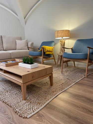 a living room with a couch and a coffee table at Wine Inn Boutique in Sintra
