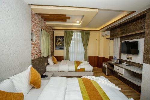 Ένα ή περισσότερα κρεβάτια σε δωμάτιο στο Gauri Shankar Hotel Nagarkot