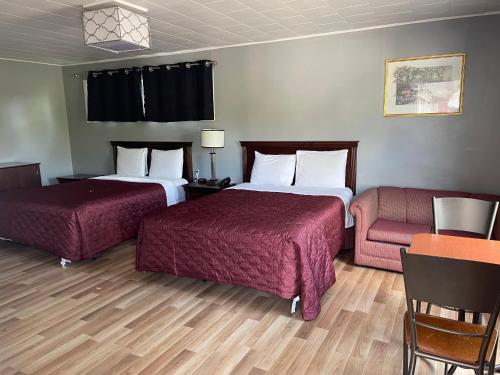 Postel nebo postele na pokoji v ubytování Nites Inn Motel