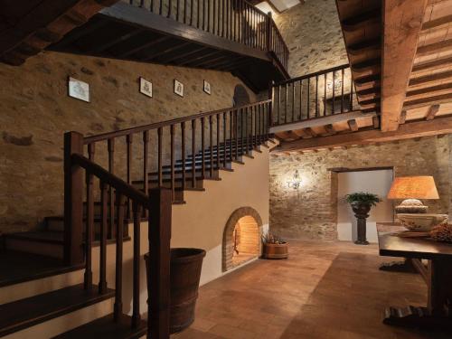 a large hallway with stairs in a stone building at Charming House in Umbria with Pool in Monte Castelli