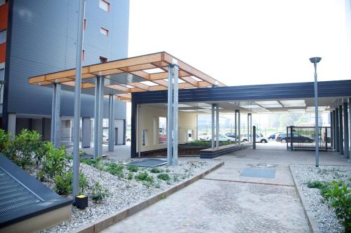 an empty parking lot in front of a building at Residence Milano Bicocca in Milan