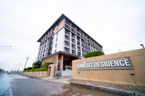 a building with a sign that reads transit residence at Rangsit Residence in Ban Talat Rangsit