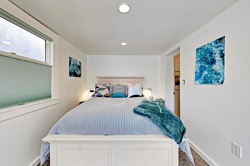 a bedroom with a bed and a window at Beach Haven in Santa Cruz