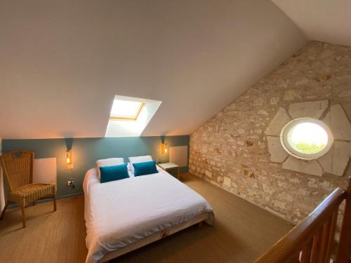 Postel nebo postele na pokoji v ubytování Villa de charme face à l'océan, sur une Ile avec accés direct plage