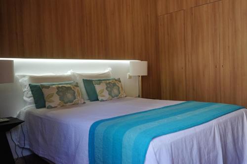 מיטה או מיטות בחדר ב-As Cabanas dos Netinhos