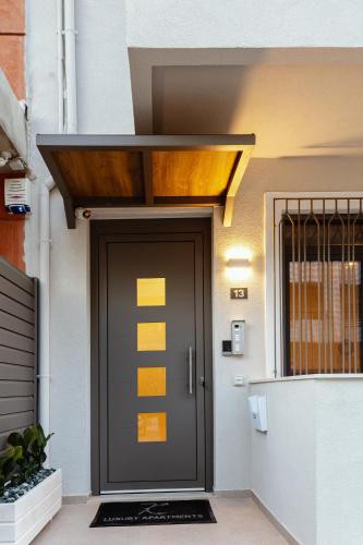 a front door of a building with yellow stickers on it at 7 City Luxury Apartments in Rethymno Town