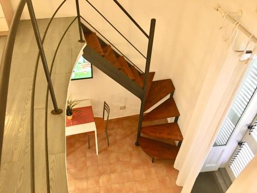 a staircase in a house with a table at Casa Mafalda B&B in Lipari