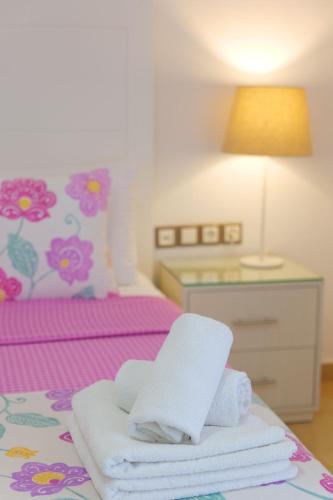 a bedroom with a bed with towels on it at Hotel Mira Mare in Ksamil