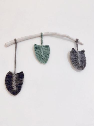 three leaf earrings hanging on a branch at Hotel Aegeon in Mylopotas