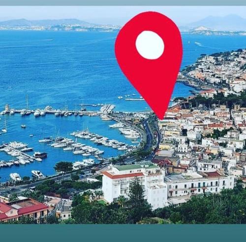 a red map of a harbor with boats in the water at Marina Luxury Apartments in Ischia