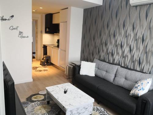 a living room with a couch and a table at My G yoo Apartment #2 in Istanbul