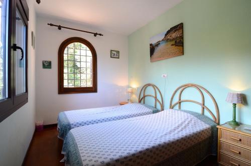 Posteľ alebo postele v izbe v ubytovaní SA PUNTA 60