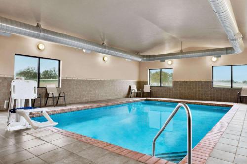 a pool in a hotel room with at Baymont by Wyndham Sioux Falls North,I-29,Russell St, Airport in Sioux Falls