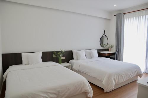 Llit o llits en una habitació de Hoang Loc Villa