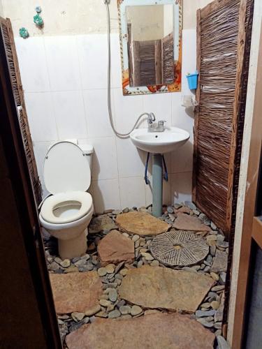 a bathroom with a toilet and a sink at Dong van hmong homestay in Dồng Văn
