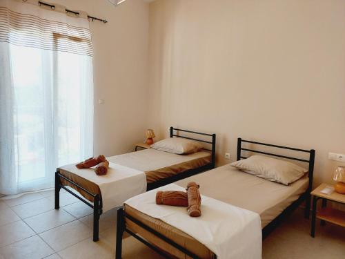 Postel nebo postele na pokoji v ubytování STAMATIS CORFU APARTMENTS