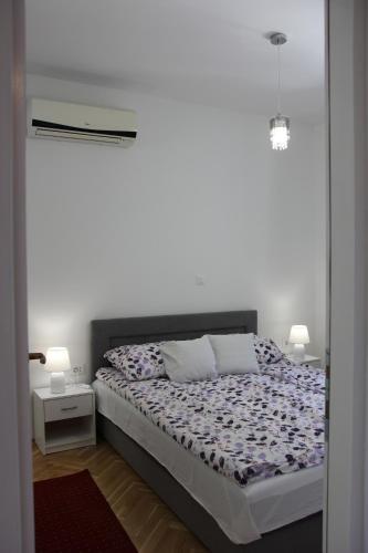 Posteľ alebo postele v izbe v ubytovaní Apartment Kantrida