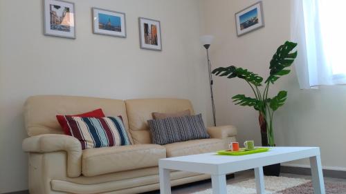 a living room with a couch and a table at StaynFeel 01 in Fátima