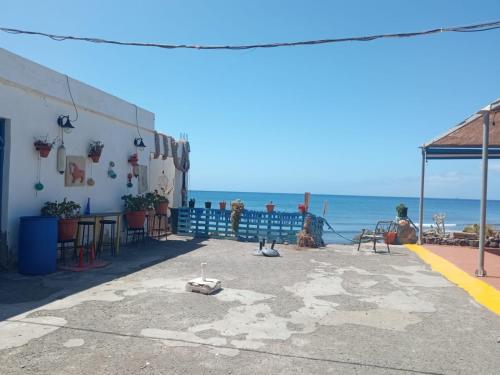 a restaurant with a view of the ocean at Heva Home in Tarajalejo