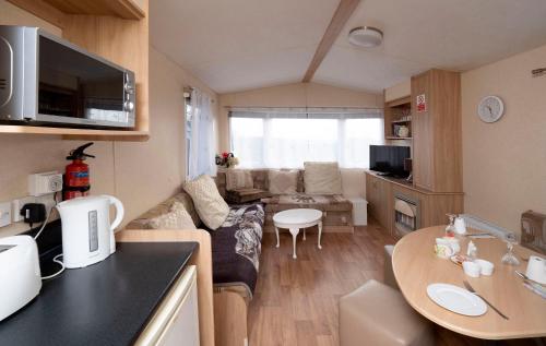 a small living room with a couch and a table at Crockgarve B and B in Galbally